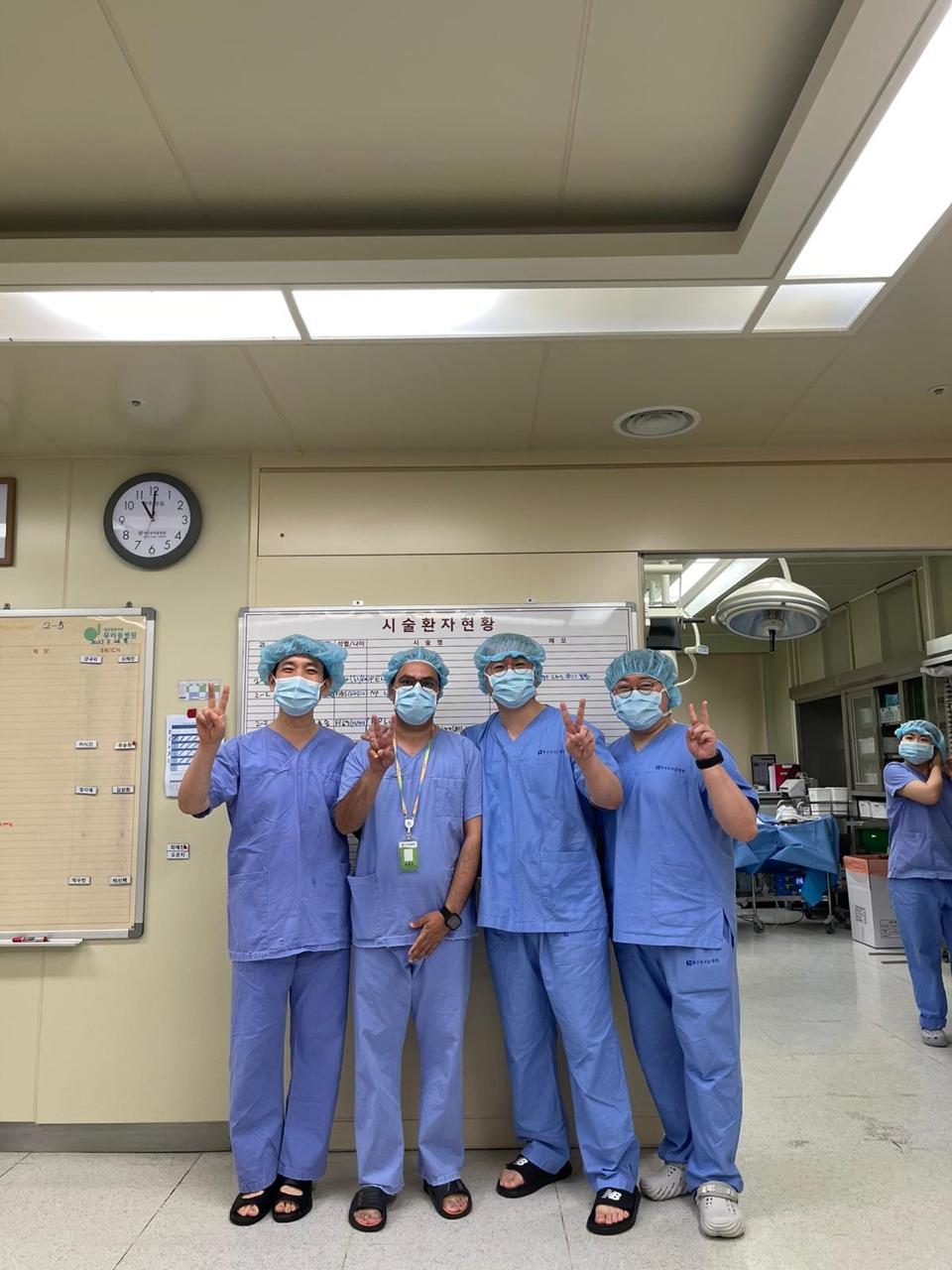 Dr. Mian Awais operating room surgical team in Korea